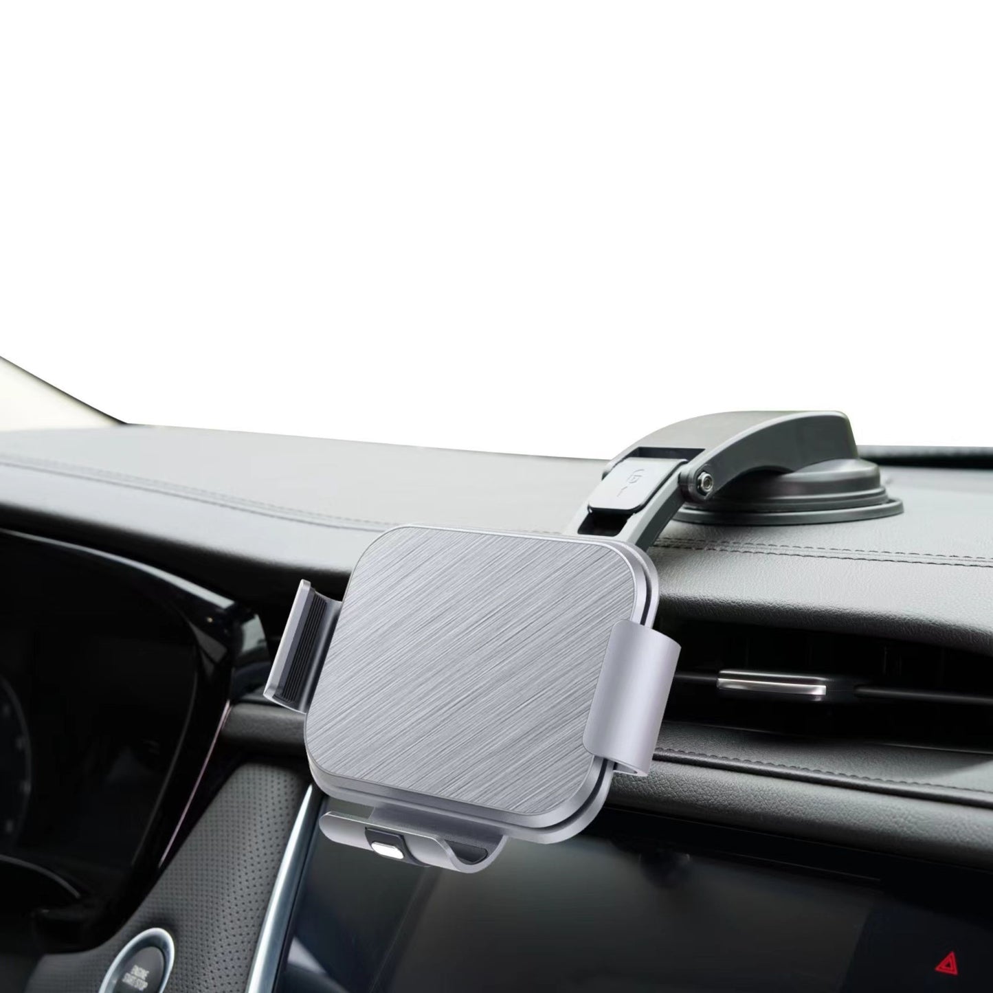 Silver car dashboard phone holder mount with suction cup attached to dashboard