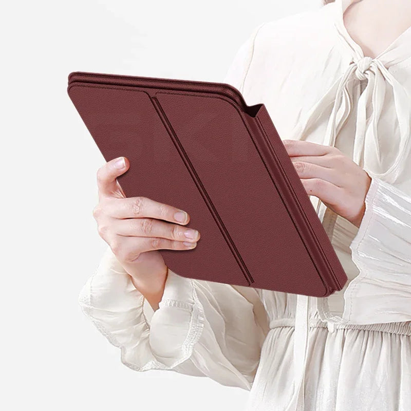 Person holding a maroon tablet case against a white background