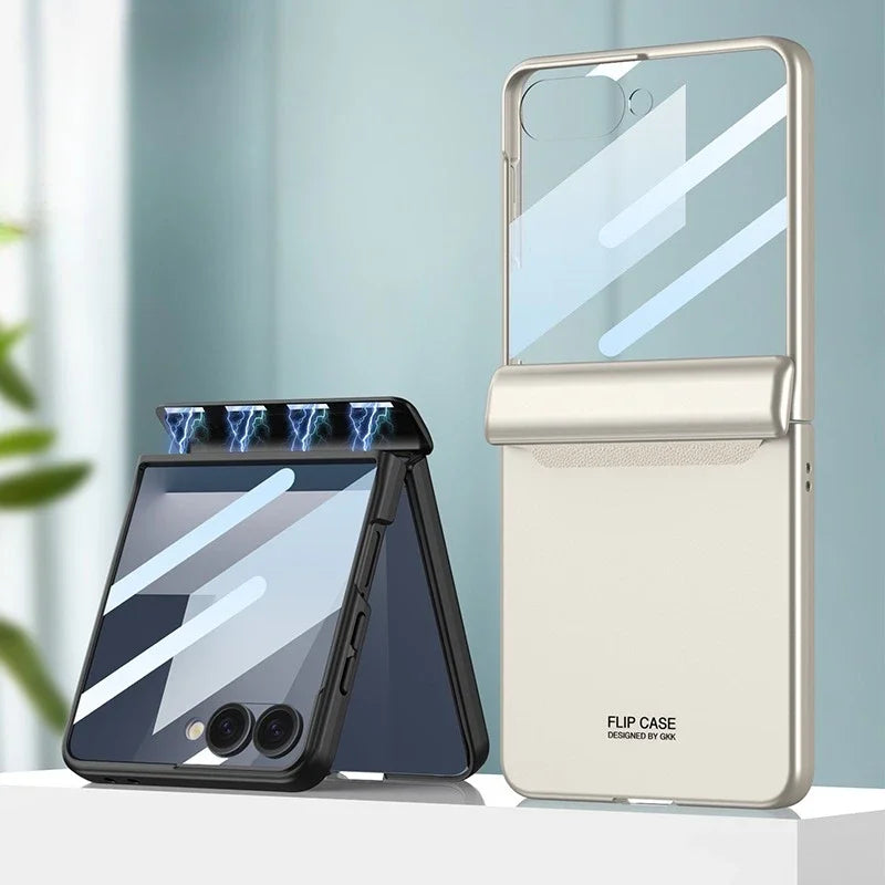 Two flip phone cases, one black and one white, on a light surface with a blurred background.